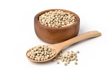 White  peppercorns (white pepper) in wooden bowl and spoon isolated on white background.