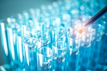 science hand holding laboratory test tubes , laboratory equipment , science background