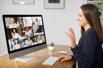Virtual conference, online meeting. Business woman using computer app for communicating with many...