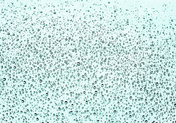 Rain drops on glass in rainy weather. Background.