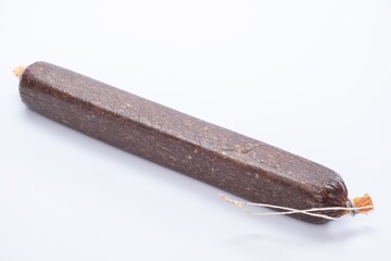 Jerky on a white background. Close-up of basturma sliced into pieces.