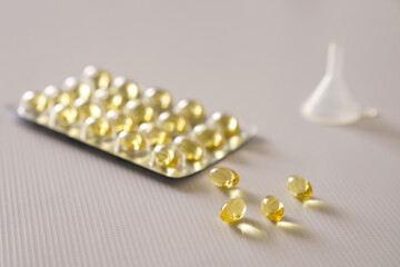 Omega 3 fish liver oil capsules in white background. Close up.