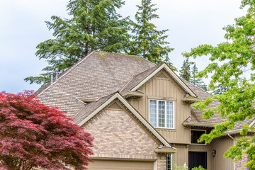 The top of the house or apartment building with nice window.
