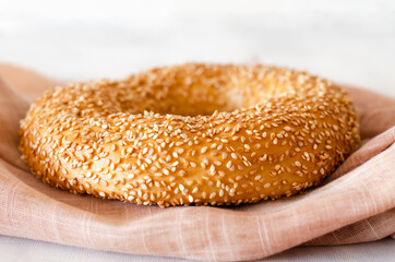 Turkish round bagel Simit with sesame seeds, a traditional Turkish bakery. Selective focus. Close-up.