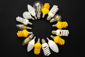 White and yellow light bulbs on black background