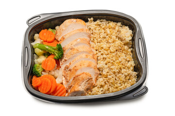 Ready food in a container. Stewed chicken, stewed carrot, cabbage and porridge.