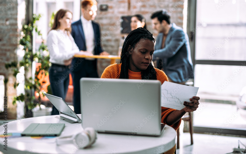 Wall mural cinematic image of employers working in a start up business