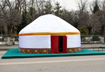 Traditional national Kazakh yurt standing on the city square during the celebration of Nauryz, nomadic way of life