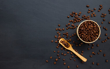 coffee beans on old black wooden table background. mockup and templates to create greeting, cards, magazines, cover, poster and banners etc. space for text. top view. flat lay