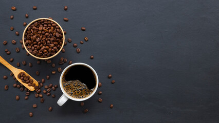 hot coffee and bean on old black wooden table background. mockup and templates to create greeting, cards, magazines, cover, poster and banners etc. space for text. top view. flat lay