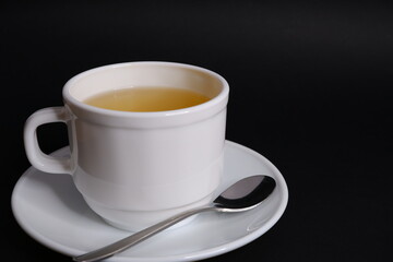 Cup of tea on black background
