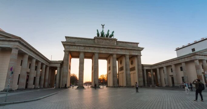 Day to night hyper lapse of famous Brandeburg Gate (Brandenburger Tor) in central Berlin, on a warm spring day with no clouds in 4k