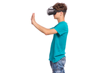 Portrait of young caucasian teen boy using virtual reality goggles. Funny teenager looking in VR glasses. Handsome child experiencing 3D gadget technology, isolated on white background