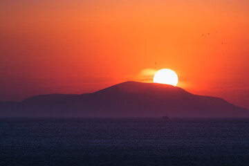 Naklejka na ściany i meble Sunset at Psara island , Chios Greece
