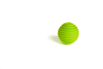Children's toys. a green ball on a white background. A toy for babies and toddlers to joyfully learn mechanical skills