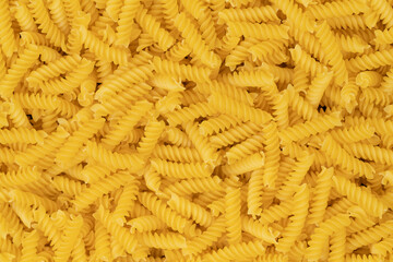 raw spiral pasta background texture