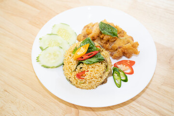 Green curry fried rice with fried chicken.
