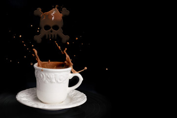 closeup of cappuccino coffee in a white cup and saucer on a black background with splashes and drops of liquid, skull and bones sign, cafe menu concept, coffee time, danger of caffeine
