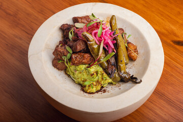 Set of different meat and seafood skewers on wooden table