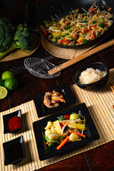 Fried vegetables from the wok with deep fried meat