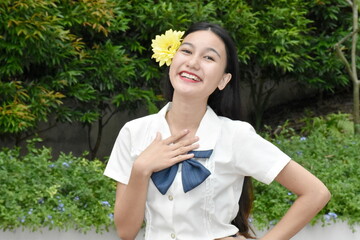 Optimistic Young Minority Female Woman With Yellow Flower