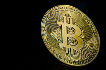 Bitcoin. Digital virtual coin on a black background