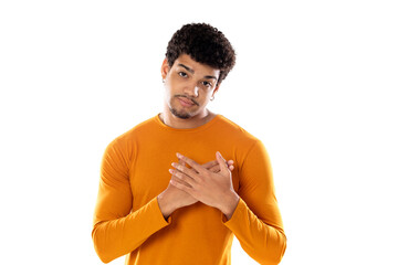 Cute african american man with afro hairstyle wearing a orange T-shirt