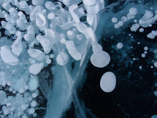 unusual frozen gas bubbles in the crystal clear ice of Lake Baikal. Siberia Russia