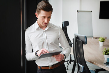 Businessman in the office with tablet