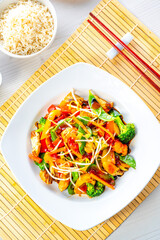 sweet and sour chicken with rice and vegetables