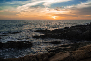 sunset over the sea with dramatic sky