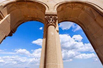 View from the arches to the beautiful blue sky with white clouds