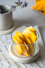 dried mango chips in a clear jar