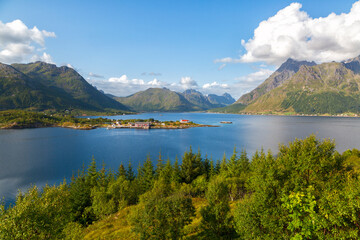 Naklejka na ściany i meble Beautiful Norwegian landscape with a lake and mountains in summer day