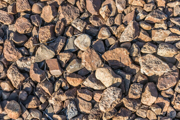 Crushed granite railway embankment close-up.