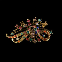 Antique silver brooch with precious stones and crystals in the shape of a flower. Vintage brooch...