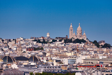 Fototapeta na wymiar View of the Sacré-Cœur next to Saint-Pierre de Montmartre on the summit of the butte Montmartre.