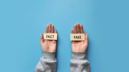 Inscriptions: fact and fake in the hands of a person. A person's choice between truth and falsehood