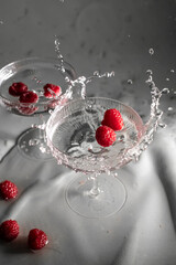 Cocktail with raspberry and transparent drink