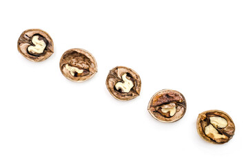 Walnuts in shells isolated on white background.Photo with shallow depth of field.