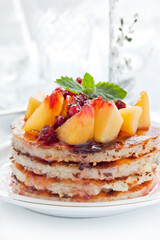 Cheese casserole with peach slices and currant jam. Sweet dessert