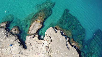 background with rocks and turquoise sea in Puglia Italy
