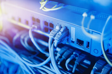 Fiber ethernet cable on network switches optical connector interface. Concept internet data center...