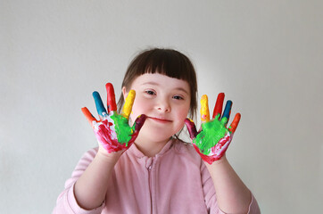 Cute little girl with painted hands. Isolated on the white background. - 428852352