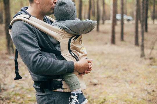 Concept Of Leisure Outdoor, Staycation, Mental Health. Dad Carrying His Baby Boy In Ergo Bag.