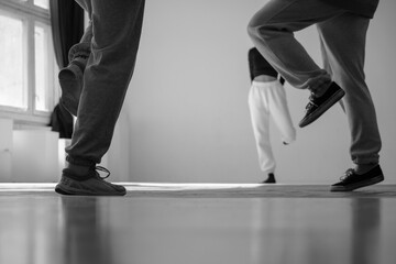 Legs, dance movements. Contemporary dance hip hop workout. Abstract blur background with shallow depth of field. 