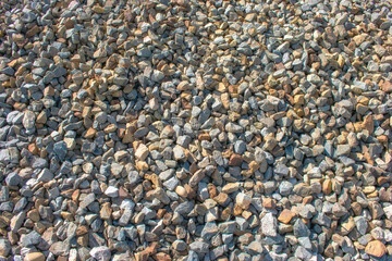 background texture of river stones on a railroad track