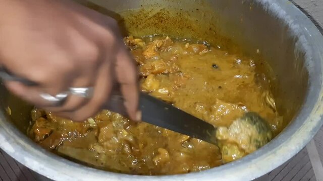 Closeup of professional chef man prepare meat gravy with spices on the oven at the kitchen, Man preparing dishes with meat