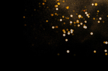 Abstract dark background with gold sparkles. Festive background for project. Blurred effect.