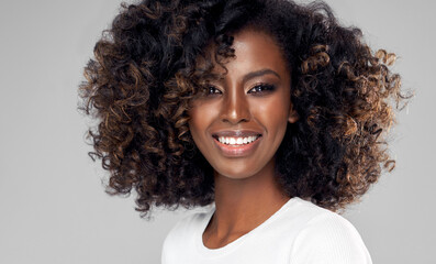 Portrait of smiling black woman with afro hair
